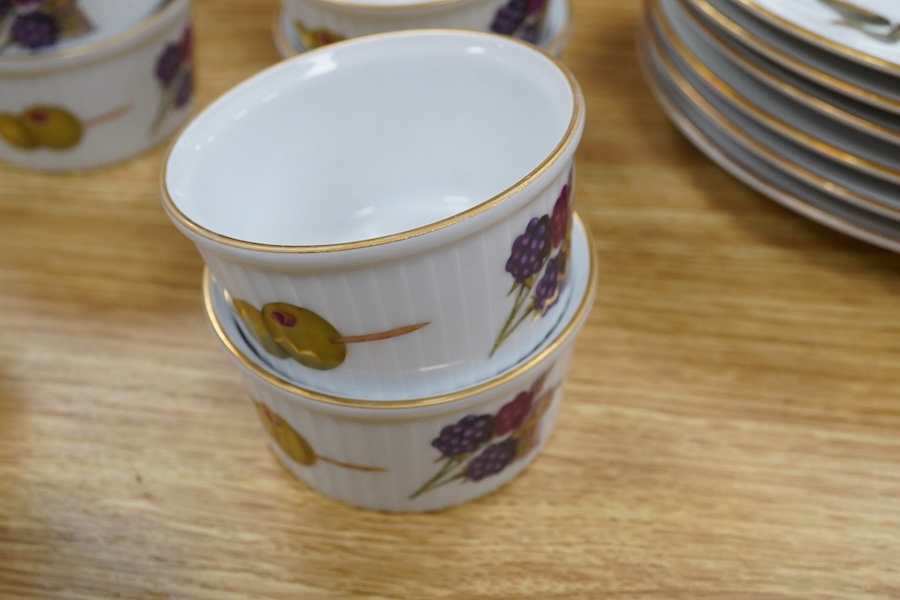 A Royal Worcester Evesham pattern dinnerware to include dinner plates, soup bowls and ramekins, largest 25cm in diameter. Condition - mostly good